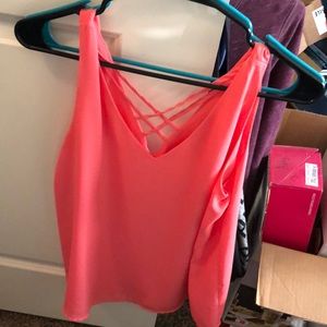 Coral tank top with crisscross pattern in the back